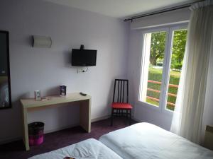 TV a/nebo společenská místnost v ubytování Hotel Agena Hagondange