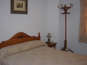 Posteľ alebo postele v izbe v ubytovaní Hostal Restaurante La Muralla