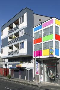 a colorful building on the side of a street at Hotel Café Color in Armenia