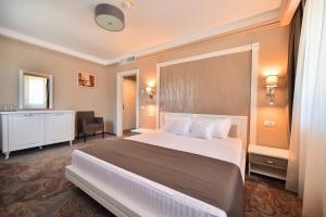 Postel nebo postele na pokoji v ubytování Hotel Scapino