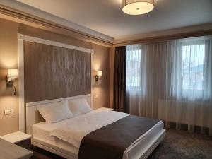 Postel nebo postele na pokoji v ubytování Hotel Scapino + 35 fotografií