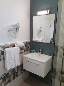 Koupelna v ubytování Hotel Scapino