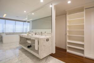 a bathroom with a sink and a large mirror at Presidente InterContinental Guadalajara by IHG in Guadalajara