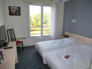 Postel nebo postele na pokoji v ubytování Hotel Agena Hagondange
