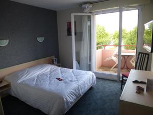 Postel nebo postele na pokoji v ubytování Hotel Agena Hagondange