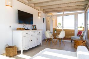 TV a/nebo společenská místnost v ubytování Attico Estrella