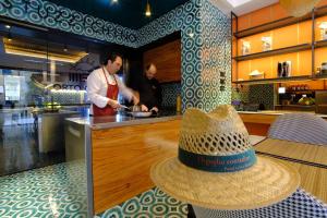 a hat sitting on top of a table in a kitchen at Casa Di Dora in Massa Lubrense