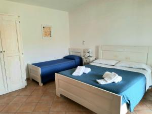 Postel nebo postele na pokoji v ubytování Agriturismo Orvile
