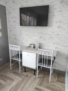 TV a/nebo společenská místnost v ubytování Chambre HORTENSIA