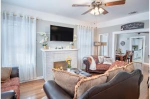 a living room with two couches and a fireplace at Stunning 3 BR Home Near DT Alamodome - Riverwalk in San Antonio