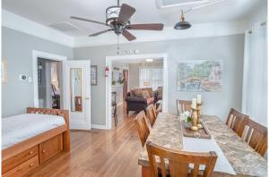 a dining room and living room with a table and chairs at Stunning 3 BR Home Near DT Alamodome - Riverwalk in San Antonio