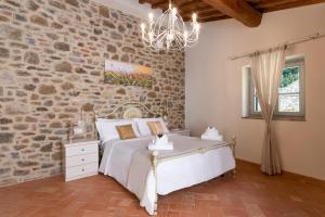 Postel nebo postele na pokoji v ubytování Chimera Tuscany Resort