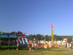 a group of people at a fair with a kite at Apartmány Vihorlat II in Kaluža