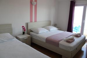 Postel nebo postele na pokoji v ubytování Apartments Renata