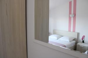 Postel nebo postele na pokoji v ubytování Apartments Renata