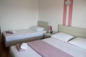 Postel nebo postele na pokoji v ubytování Apartments Renata