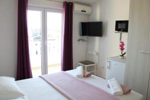TV a/nebo společenská místnost v ubytování Apartments Renata