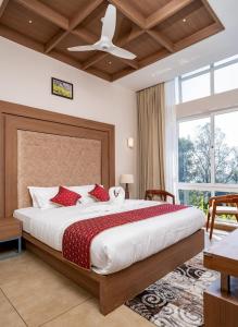 Postel nebo postele na pokoji v ubytování THRILL HOLIDAYS MUNNAR