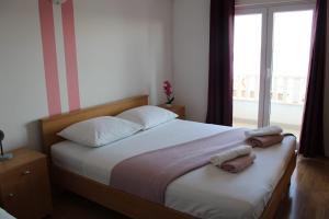 Postel nebo postele na pokoji v ubytování Apartments Renata