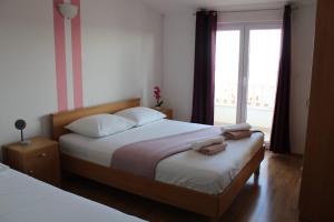 Postel nebo postele na pokoji v ubytování Apartments Renata