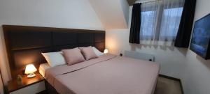 מיטה או מיטות בחדר ב-Apartman M&S - Zoned 2