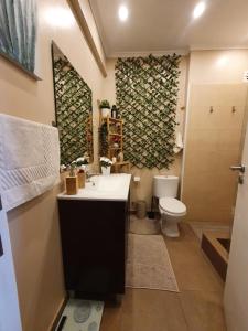 a bathroom with a sink and a toilet at N3 Apartment in Amadora +16 photos