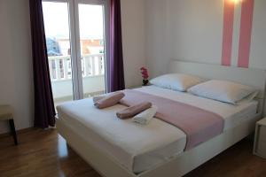Postel nebo postele na pokoji v ubytování Apartments Renata