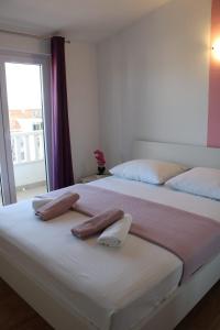 Postel nebo postele na pokoji v ubytování Apartments Renata
