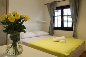 Postel nebo postele na pokoji v ubytování Apartments Renata