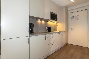 Nhà bếp/bếp nhỏ tại Apartmentvilla Anna See Apartmentvilla Anna See 1-07 +2 ảnh