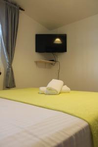 Postel nebo postele na pokoji v ubytování Apartments Renata