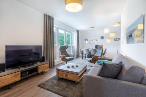 TV a/nebo společenská místnost v ubytování Aparthotel Ostseeallee Aparthotel Ostseeallee 3-27