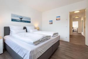 Postel nebo postele na pokoji v ubytování Aparthotel Ostseeallee Aparthotel Ostseeallee 3-27