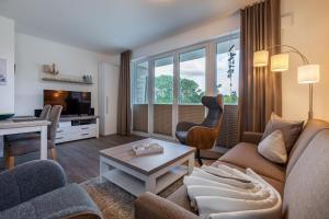 TV a/nebo společenská místnost v ubytování Aparthotel Ostseeallee Aparthotel Ostseeallee 2-15