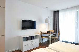 TV a/nebo společenská místnost v ubytování Deichhäuser Anna Küste Deichhäuser Anna Küste 3-22