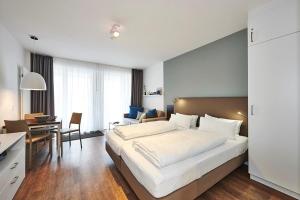 Postel nebo postele na pokoji v ubytování Deichhäuser Anna Küste Deichhäuser Anna Küste 3-22 + 8 fotografií