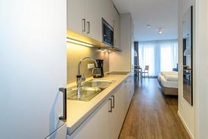 Kuchyň nebo kuchyňský kout v ubytování Deichhäuser Anna Küste Deichhäuser Anna Küste 3-22