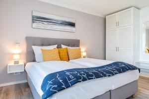 Ein Bett oder Betten in einem Zimmer der Unterkunft Godewindpark Travemünde Godewindpark Travemünde 1-07