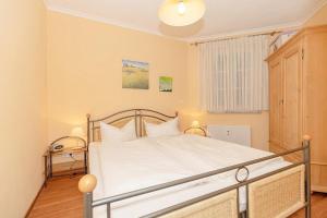 Postel nebo postele na pokoji v ubytování Apartmenthaus Atlantik Apartmenthaus Atlantik 212