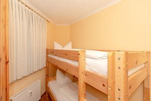 Postel nebo postele na pokoji v ubytování Apartmenthaus Atlantik Apartmenthaus Atlantik 212