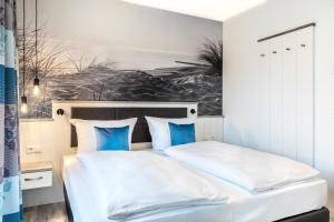 Ein Bett oder Betten in einem Zimmer der Unterkunft Apartmentanlage Meerblickvilla Apartmentanlage Meerblickvilla 2-18