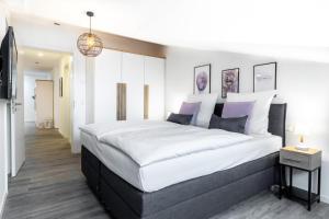 Een bed of bedden in een kamer bij Apartmentanlage Meerblickvilla Apartmentanlage Meerblickvilla 4-46