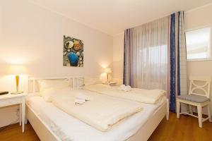 Postel nebo postele na pokoji v ubytování Urlaubsräume am Meer Urlaubsräume am Meer 3-13