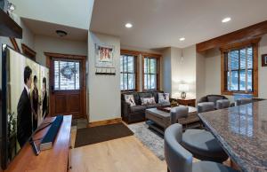a living room with a couch and a table at Ridge Street Chalet Home a Historic District Charm in Breckenridge