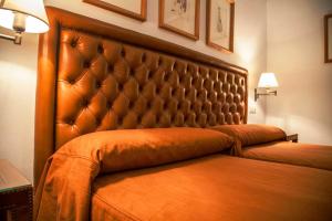 Postel nebo postele na pokoji v ubytování Hotel Boutique Casa de Orellana