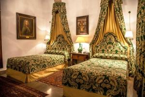 Postel nebo postele na pokoji v ubytování Hotel Boutique Casa de Orellana