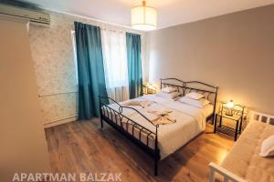 a bedroom with a bed and a large window at BALZAK 64m2, Free parking & Wi-fi in Novi Sad