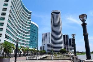 a city with tall buildings and a street light at Riverfront II, piso 2, suite vista al rio, Puerto Santa Ana, Guayaquil in Guayaquil