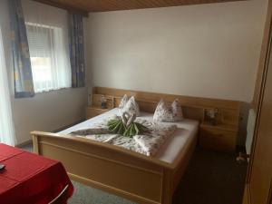 En eller flere senge i et værelse på Pension Schmiedhof