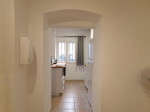 Kuchyň nebo kuchyňský kout v ubytování Appartements de l'Eglise